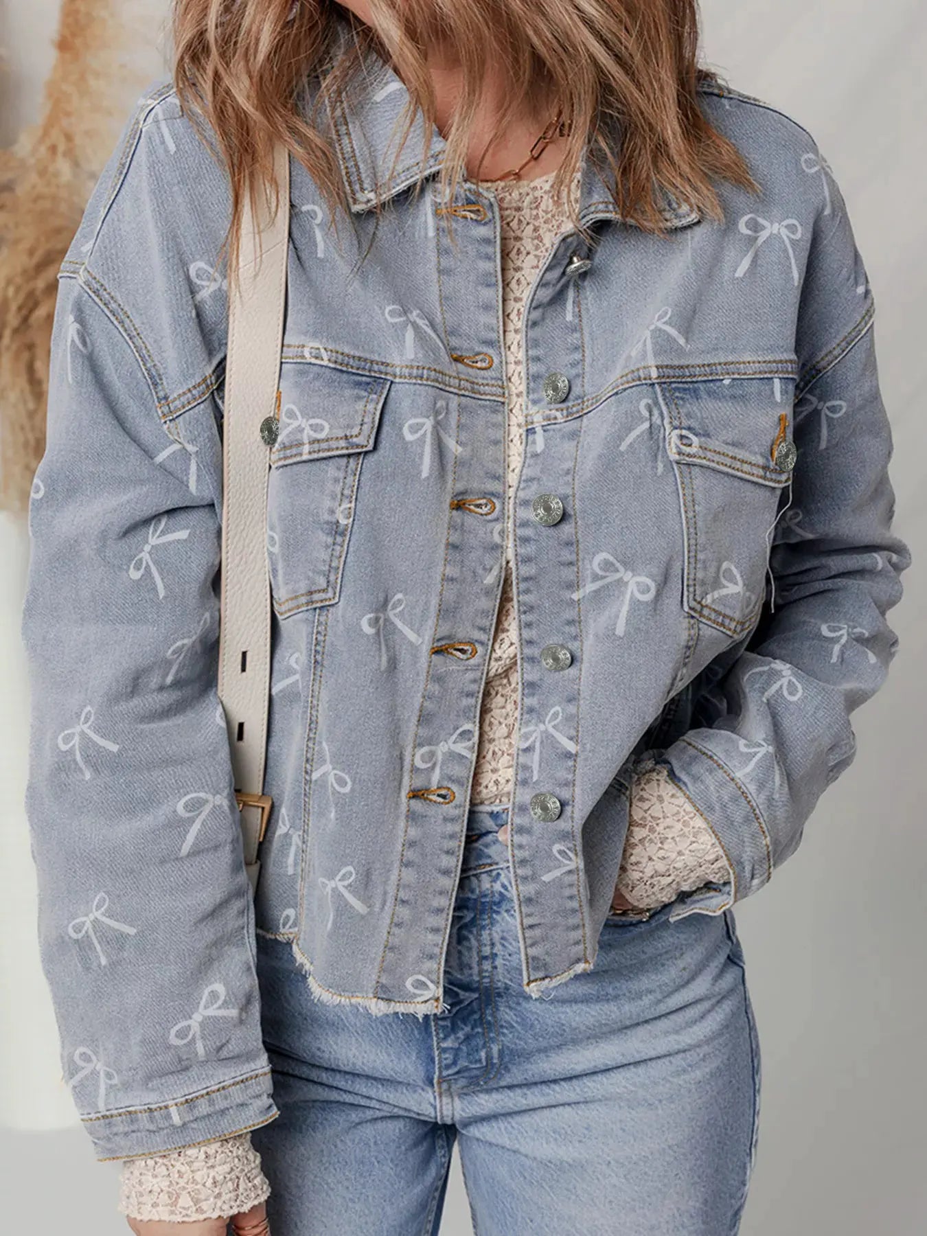 Bow Knot Print Light Wash Raw Hem Denim Jacket by Partner Label