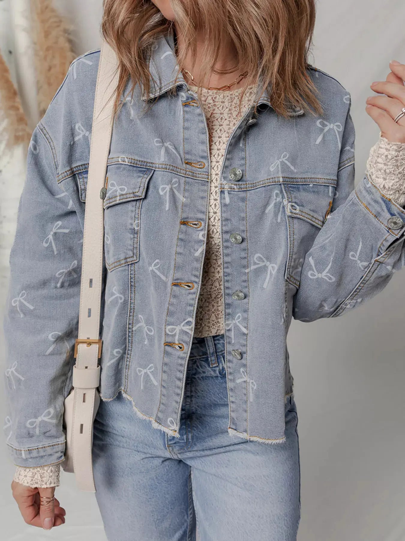 Bow Knot Print Light Wash Raw Hem Denim Jacket by Partner Label