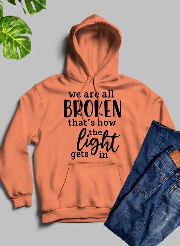 Were All Broken That's How The Light Gets In Hoodie by Merch